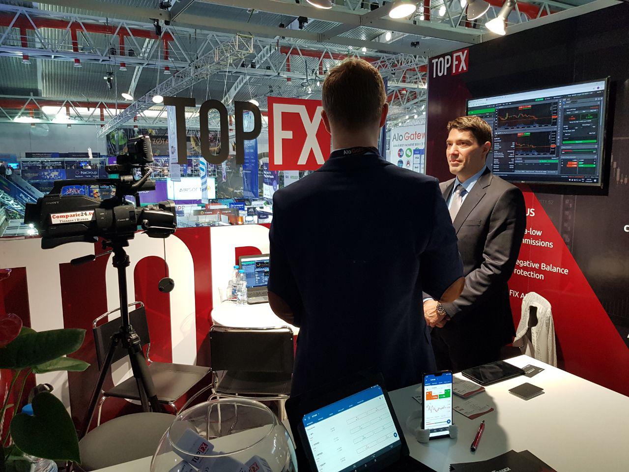 TopFX CEO Alex Katsaros being interviewed by Comparic Media Group at the iFX Expo